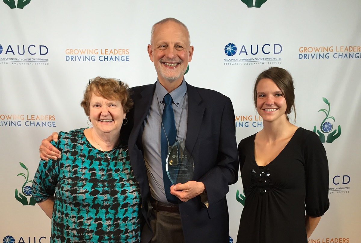 Dr. Kleinert and family with award