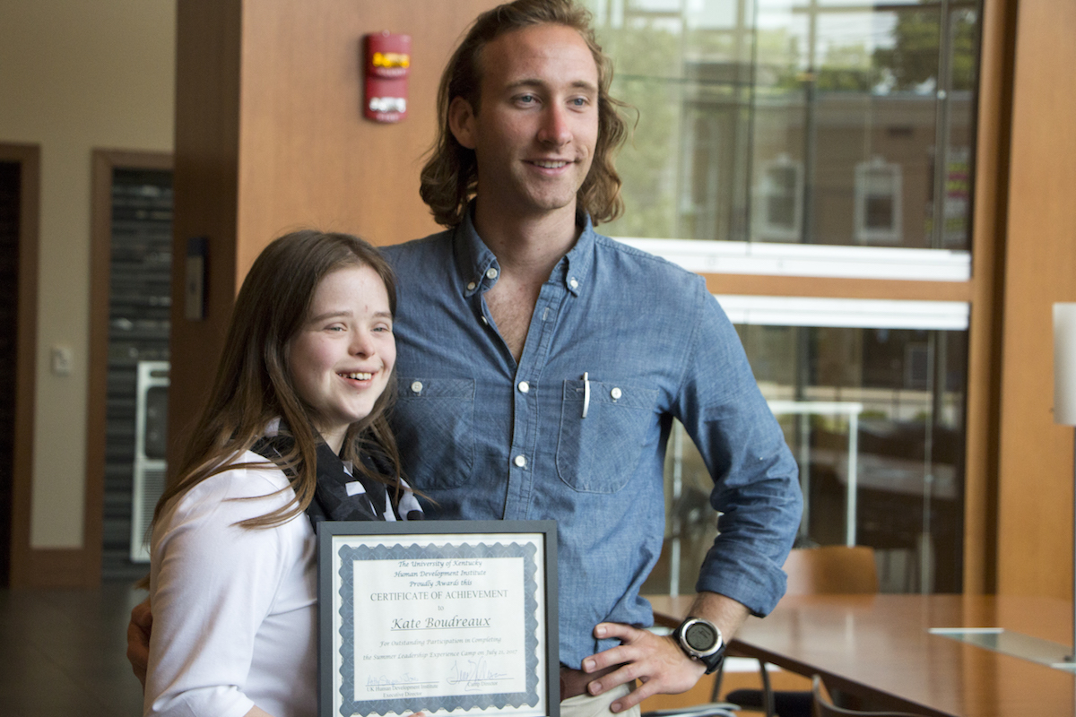 Student receiving certificate from camp.