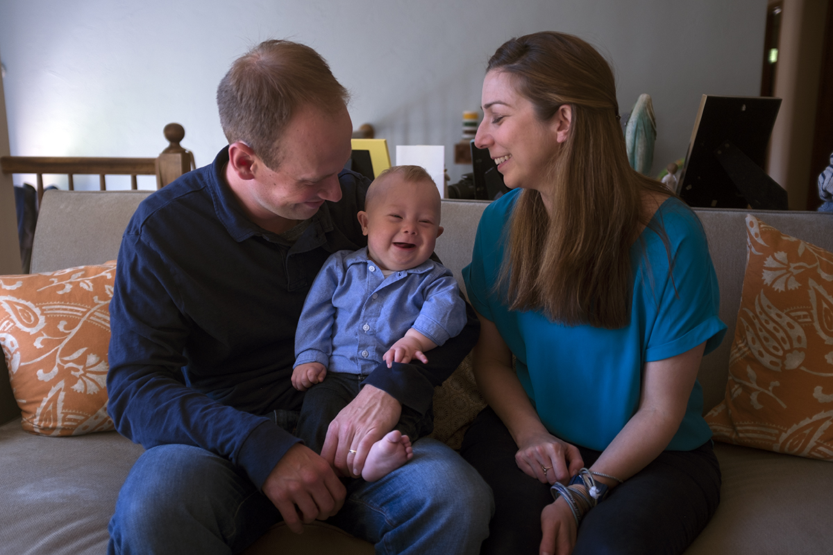 Mother and father with a baby with Down syndrome