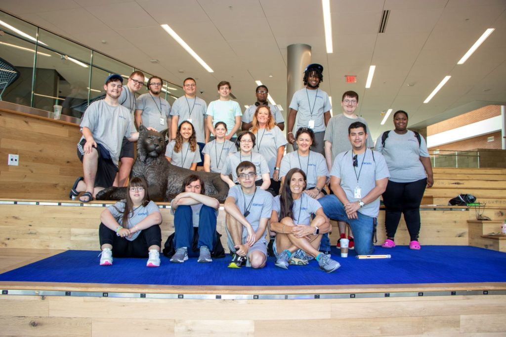 A group of high school campers sitting in UK Student Center