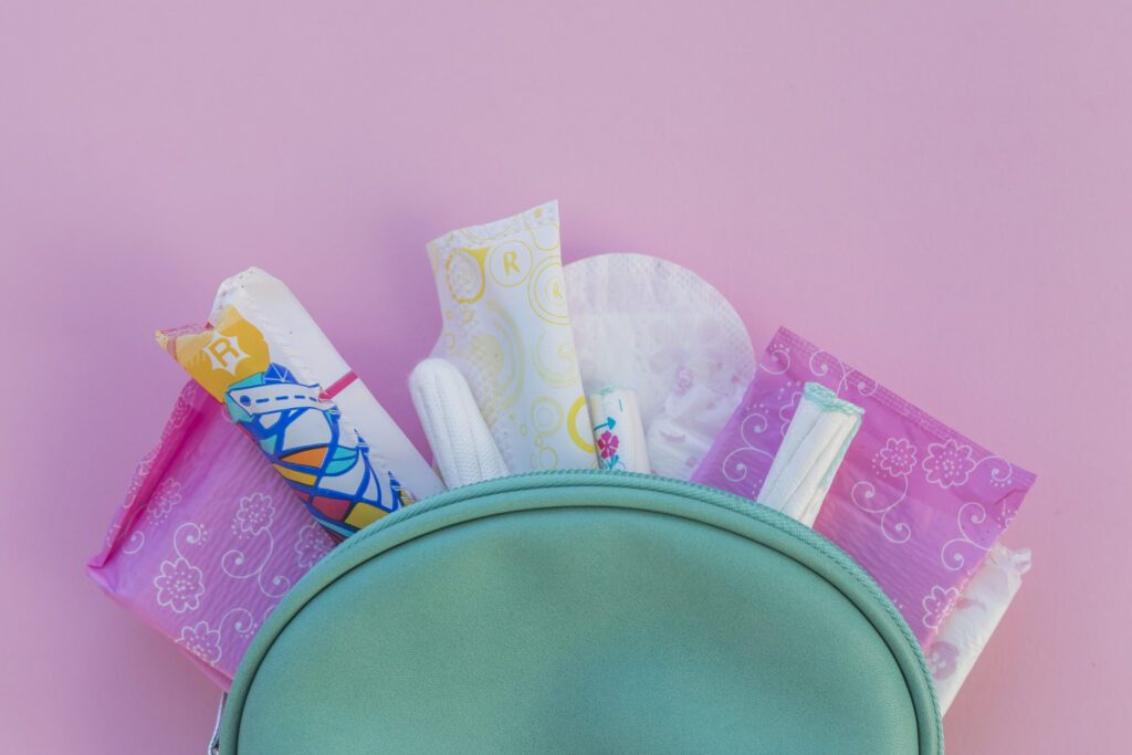 tampons, pad, and panty liners in a toiletries bag