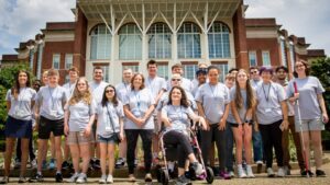 2024 Summer Camp Group Photo in front of the Library